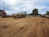 Preparation of main entrance to school: gravel for road and soil for garden.